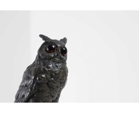German School, 20th century, a bronze owl, signed and dated 'V. &amp; E. Schmidt, 1923', on a circular black stone base,10cm 