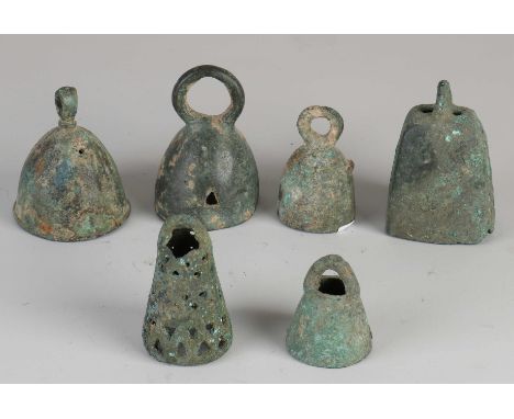 Six artefacts Luristan persia. Bronze bell holders. Circa 500 - 1000 BC. Dimensions: 5 - 9 cm. In good condition.