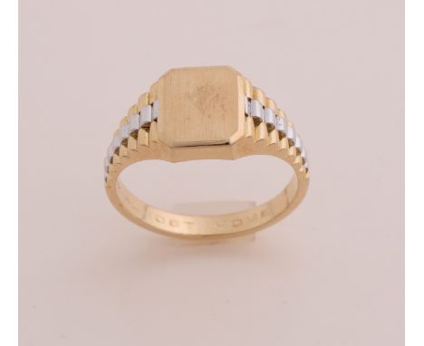 Yellow and white gold men's ring, 750/000. Signet ring with a rectangular contoured plate, decorated on the side with a rolex