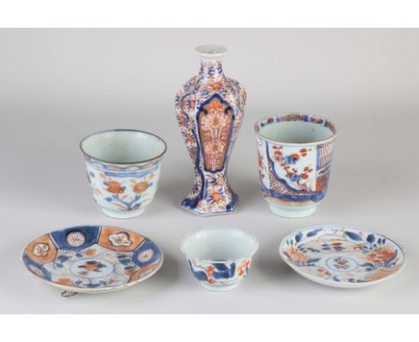 Six parts 18th century Chinese Imari porcelain. Consisting of; Octagonal vase, good, one cup good, one cup hairlines + chips,