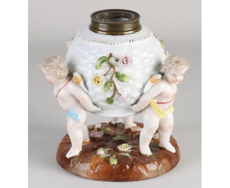 Antique porcelain German Sitzendorf inkwell with three puttis and rose decor. Lid is missing. Circa 1920. Dimensions: 15 x Ø 