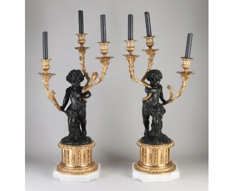 Set of monumental bronze candlesticks with putto. Tanned and polished. With Carrara marble base. 21st century. Dimensions: H 