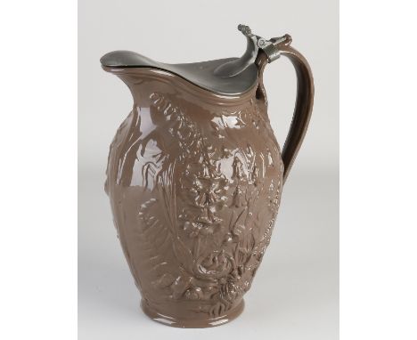 Early 19th century terracotta glazed pitcher with pewter lid. Wild decor. Unclearly signed. Dimensions: H 29 cm. In good cond