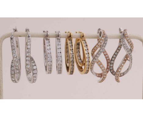 Four pairs of silver earrings, 925/000. Pair of silver and a pair of silver plated earrings with a double ring set with zirco