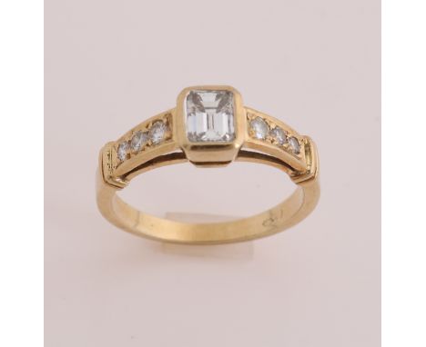 Yellow gold ring, 585/000, with diamond. sleek ring with a smooth setting in the middle with an emerald cut diamond, 5x6mm. T