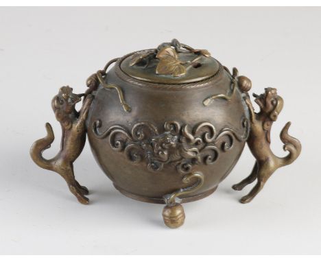 Chinese bronze incense burner with foo dogs and floral decor. 19th century. Dimensions: 8 x 9 x 14 cm. In good condition.