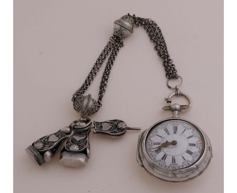 18th century silver watch, 925/000, in original silver protective case. Equipped with a chatelaine with key and signets. The 