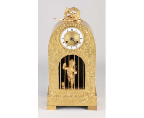 Fire gilt French bronze Empire mantel clock with amor behind bars. Eight-day movement, half-hourly strike, string pendulum. C