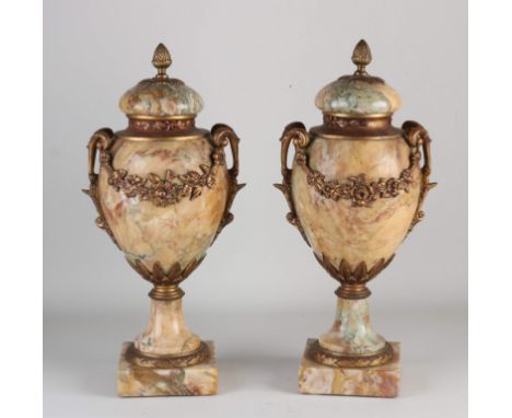 Two antique French cassolettes of marble and bronze. Circa 1900. Dimensions: H 43 cm. In good condition.