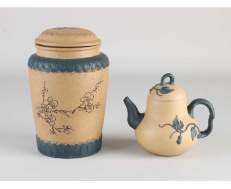 Two parts Chinese Yixing stoneware. 1x Pumpkin-shaped teapot. 1x Tea caddy, marked. Dimensions: 11 - 16 cm. In good condition