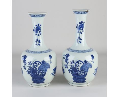 A pair of Chinese porcelain pipe vases with floral/book decor. With double blue bottom ring. One vase edge damage. Dimensions