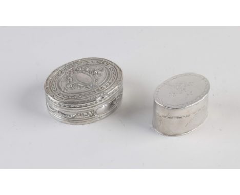 Two silver boxes, 800/000, oval model with hinged lid. Small model decorated with engraved line work and a flower decoration 