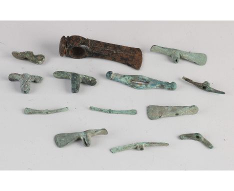 Thirteen bronze artefacts from Luristan. Circa 500 - 1000 BC. Among other; carved ax + twelve miniature pickaxes. Size: 3 - 9