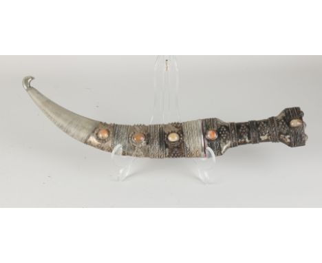 Oriental crooked dagger with mineral stones. 20th century. Dimensions: 40 cm. In good condition.