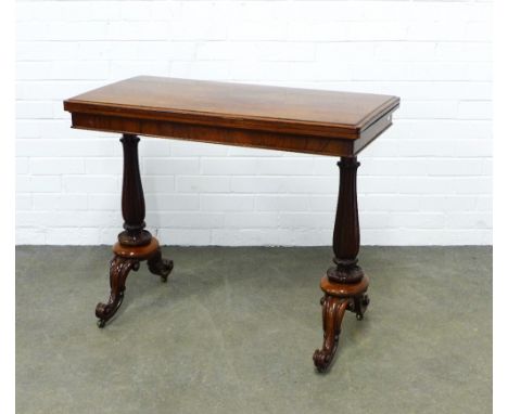 William IV rosewood card table by W &amp; C Wilkinson, the fold over top standing on lappet carved legs with scrolled support