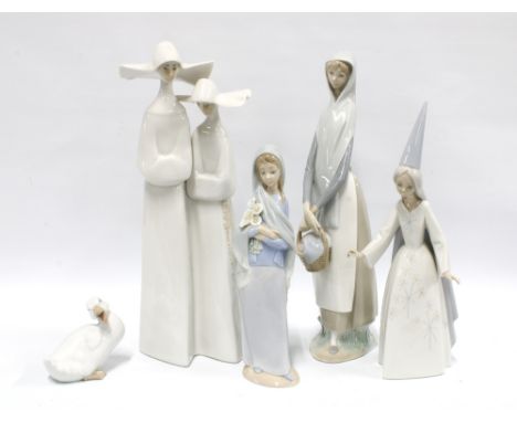 Four Lladro figures and a Nao figure (5) 