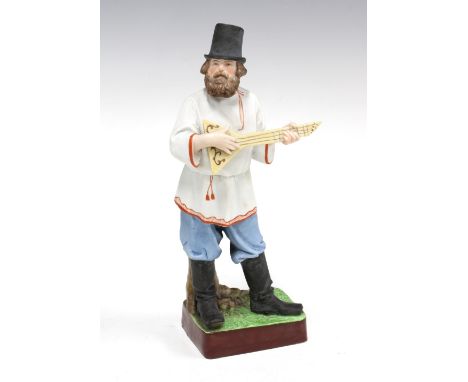 Russian bisque figure of a balalaika player, bears Gardner Porcelain Factory backstamp, 10 x 23cm.&nbsp;&nbsp;(a/f head has b