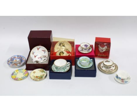 A collection of miniature bone china and porcelain cups and saucers (a lot)