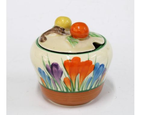 Clarice Cliff Bizarre, Crocus pattern preserve jar and cover, printed backstamp, 8 x 8cm. 