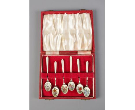 A cased set of six silver and enamel spoons featuring floral designs including roses and pansies. Hallmarked Birmingham  1977