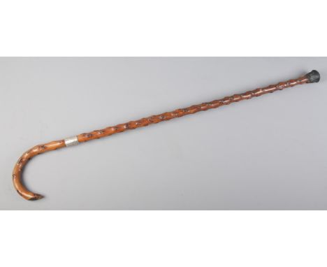 A silver collared Hawthorne masonic walking stick with curved handle. Silver collar engraved S.E.I.D.  