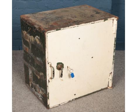A vintage cast iron safe. (66cm x 66cm x 45cm)  
