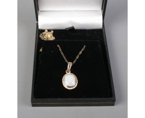 A 9ct gold Opal pendant and chain in original box.  