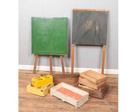 Two vintage easels/chalk boards along with a collection of wooden trays and concrete moulds.  