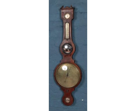 An early twentieth century banjo barometer, with convex mirrored panel and thermometer. Height: 105cm.  