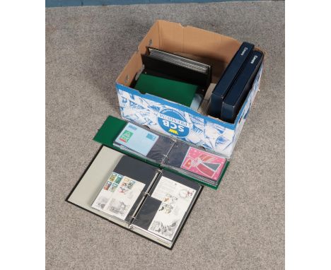A box of first day covers mostly displayed in 8 folders and includes British and Channel Island examples.  