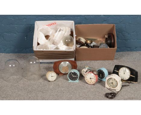 Two boxes of clocks and glass domes. Including alarm clock examples, etc.  
