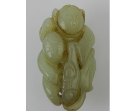 A Chinese jade pendant, in the form of two children holding a ruyi H.5cm 