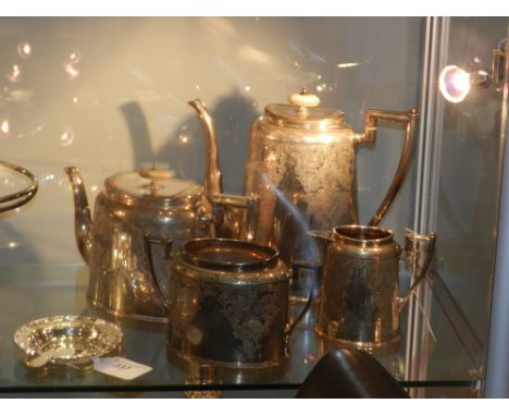 An Edwardian silver plated four piece tea service, comprising hot water pot, teapot, sugar basin and cream jug, with foliate 