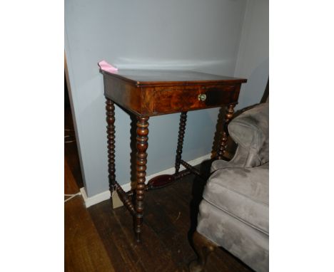 A George III side table with single drawer and bobbin turned legs, joined by stretcher. H: 76cm L: 56cm W: 41cm