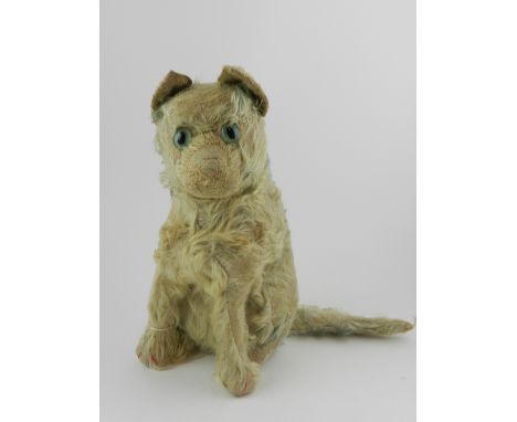 An early 20th century Steiff mohair seated cat, having glass eyes, button to ear. 