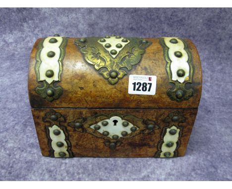 A Mid XIX Century Walnut Tea Caddy, of rectangular form with domed lid, elaborately applied with studded brass and bone panel