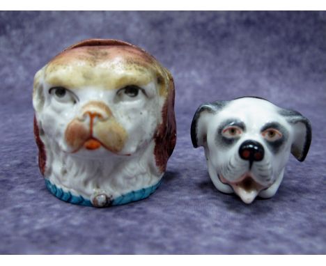 A Late XIX Century German Patch Box with hinged cover, modelled in the form of a dog's head, 4.5cm long; A Staffordshire Mone