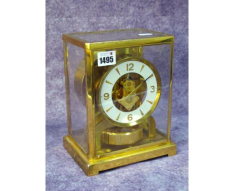 A Jaeger Le Coultre Atmos Clock, in gilt brass glazed case, the white enamel chapter ring with Arabic numerals, serial number