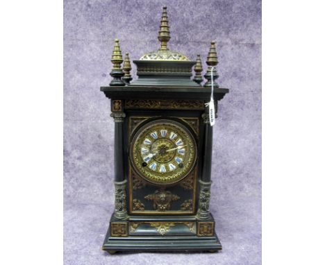A Late XIX Century Continental Bracket Clock, of Gothic design, the ebonised case applied with cast metal mounts, the brass d