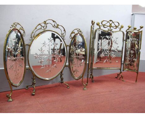An Early XX Century Brass Framed Firescreen, with detachable side panels, the central oval glass panel cut with a floral moti