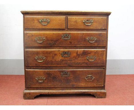 An XVIII Century Oak Chest of Drawers, the top with moulded edge, two short and three long drawers on bracket feet, 86cm high