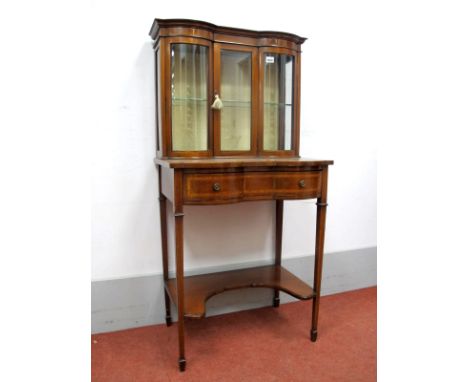 An Edwardian Inlaid Mahogany Serpentine Shaped Display Cabinet, the top with single bevelled glass door to single shelf, the 