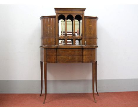 An Edwardian Mahogany Inlaid Cabinet, the frieze with swag decoration over tapering supports, mirror back flanking shaped cup