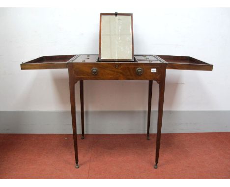 A Late XVIII Century Mahogany Dressing Table, with central mirror, four compartments with hinged lids, on tapering legs on ca