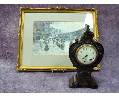 An Early XX Century Mahogany Cased Mantel Clock, of roccoco form, the white enamel dial with black Arabic numerals and inscri