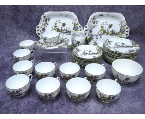 A Royal Worcester Porcelain Part Tea Service, decorated in the Chinoiserie style with figures on bridges before pagodas, comp
