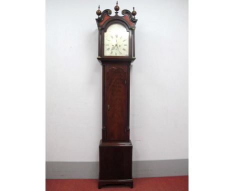 An XVIII Century Mahogany Eight-Day Longcase Clock, the hood with bulbous finials and swan neck pediment over fretwork panels