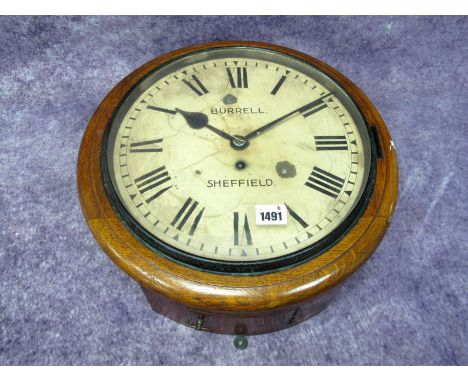 A Burrell Sheffield Oak Cased Wall Clock, the cream enamel dial with Roman numerals, winder present, 37cm diameter.