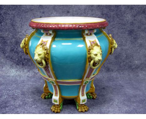 A Late XIX Century Majolica Pottery Jardiniére, of baluster form with lion mask ring handles and paw feet, the turquoise grou