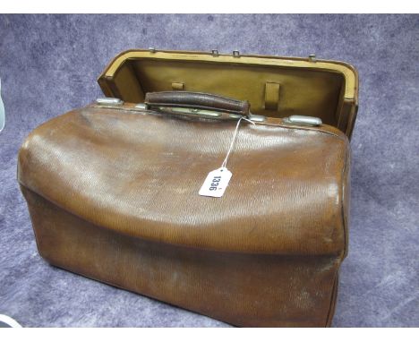 An Asprey &amp; Sons Vintage Leather Gladstone Vanity Case, the interior with compartments and fold out mirror, stamped mark,